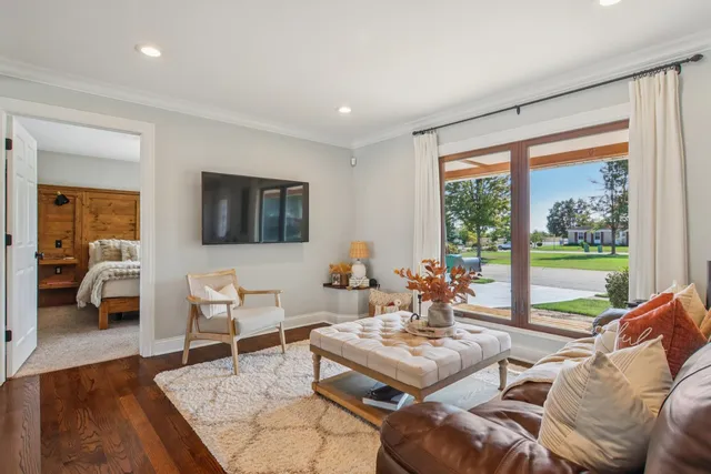 a living room with furniture and a large window