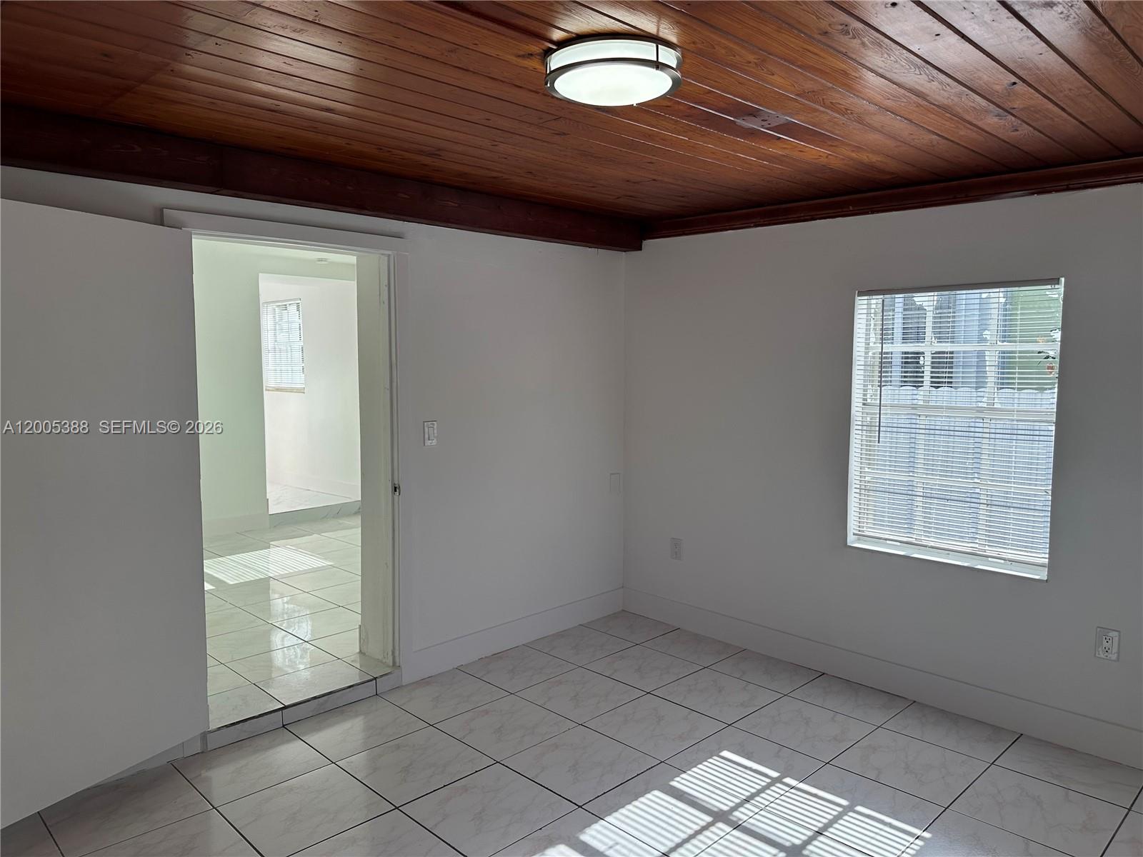 1765 Southwest 21st Street, Unit 3 Miami, FL 33145 - Photo 13 of 15 an empty room with windows