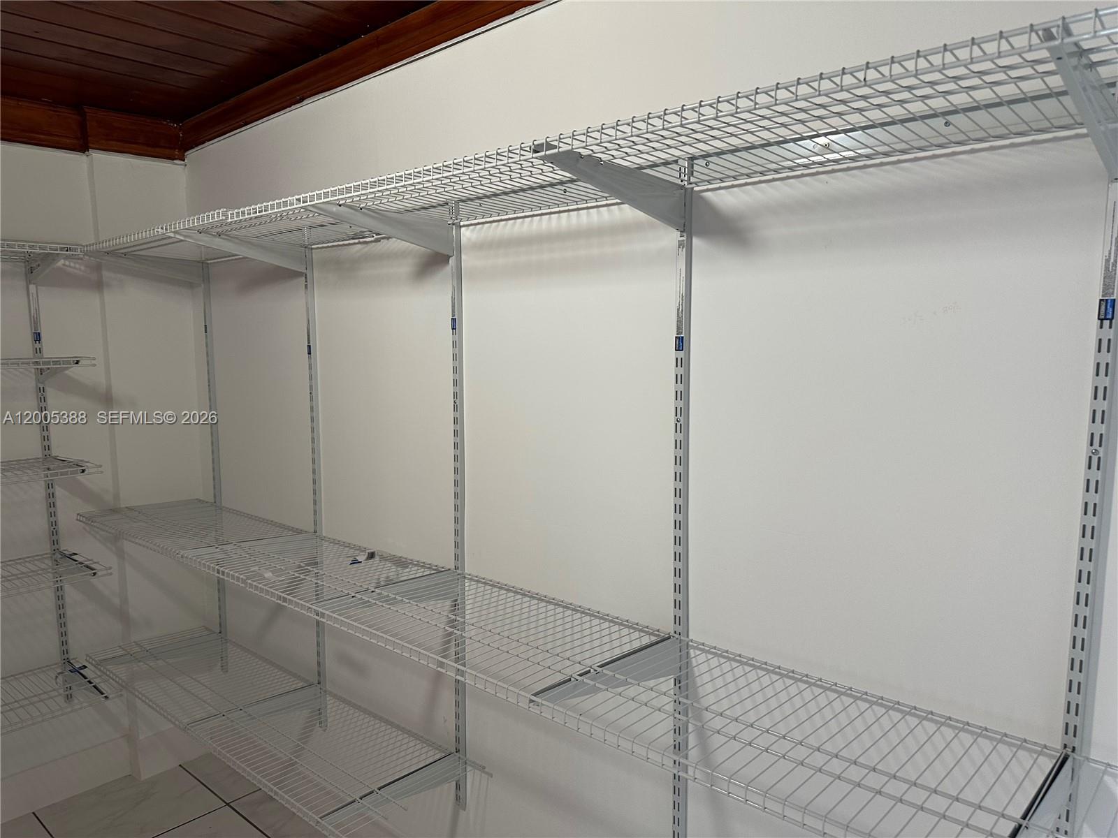 1765 Southwest 21st Street, Unit 3 Miami, FL 33145 - Photo 14 of 15 a view of a room with racks on the wall