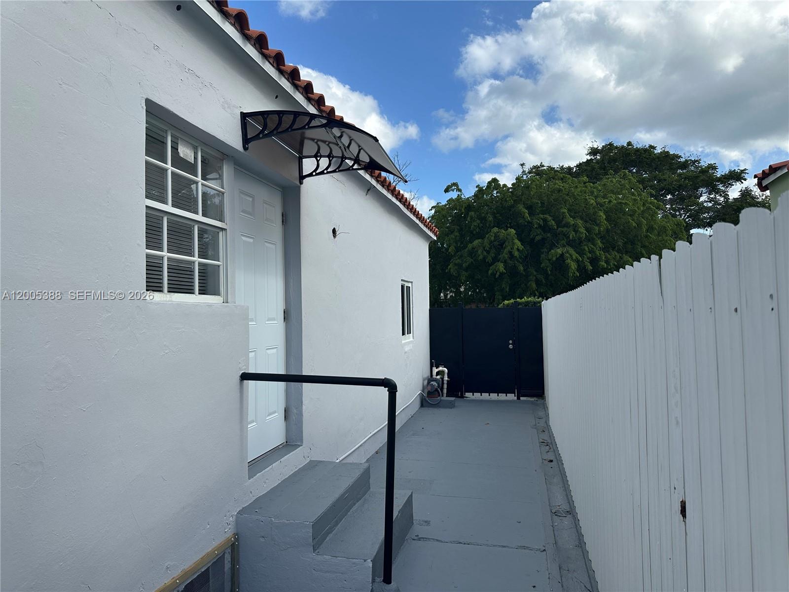 1765 Southwest 21st Street, Unit 3 Miami, FL 33145 - Photo 15 of 15 a view of outdoor space and deck