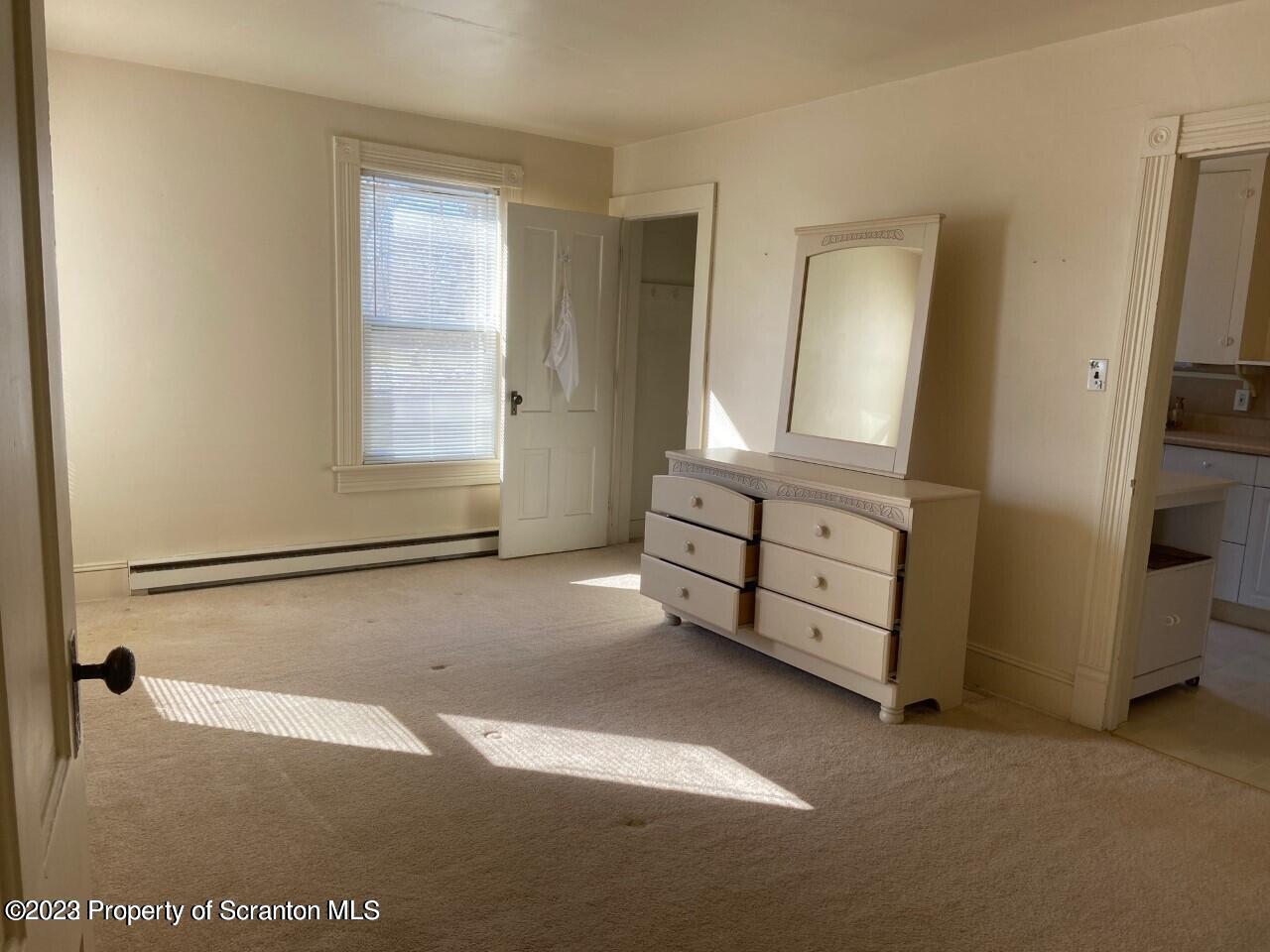 Undisclosed Address Clarks Summit, PA 18411 - Photo 2 of 8 a view of empty room with window and wooden floor