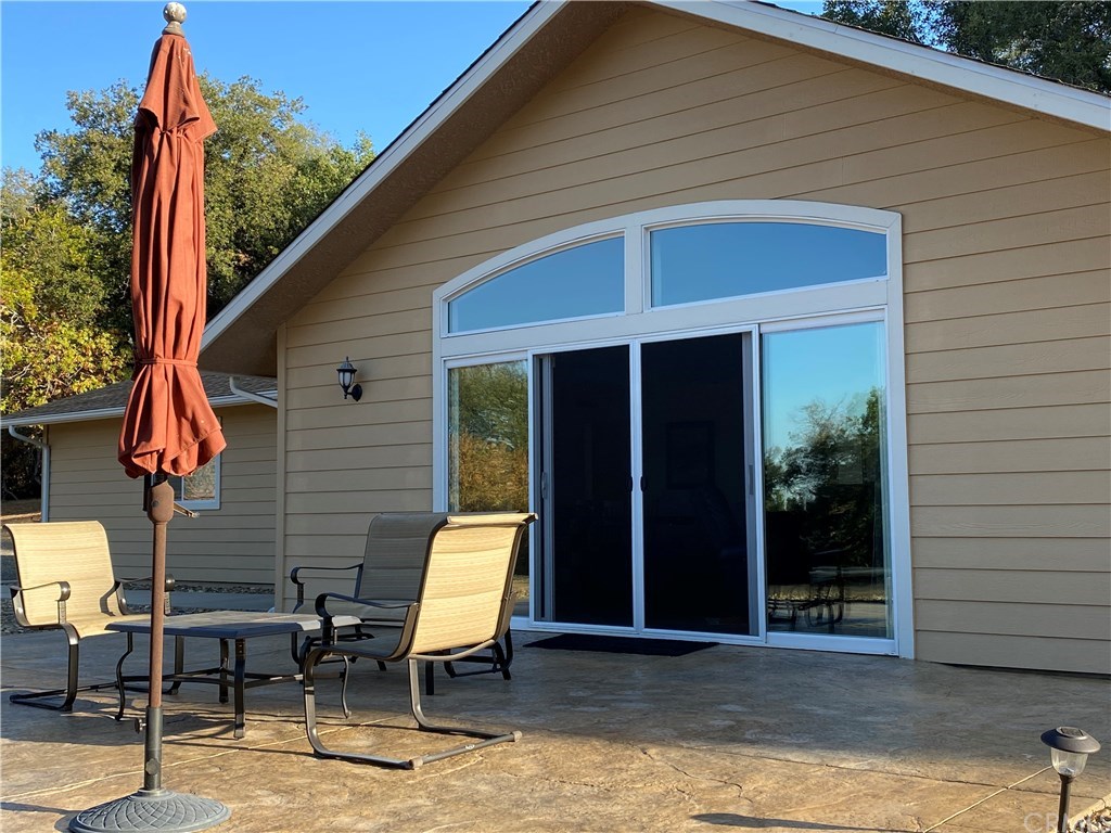 6180 Carter Road Mariposa, CA 95338 - Photo 1 of 1 Large Stamped concrete patio. Great Room through slider.