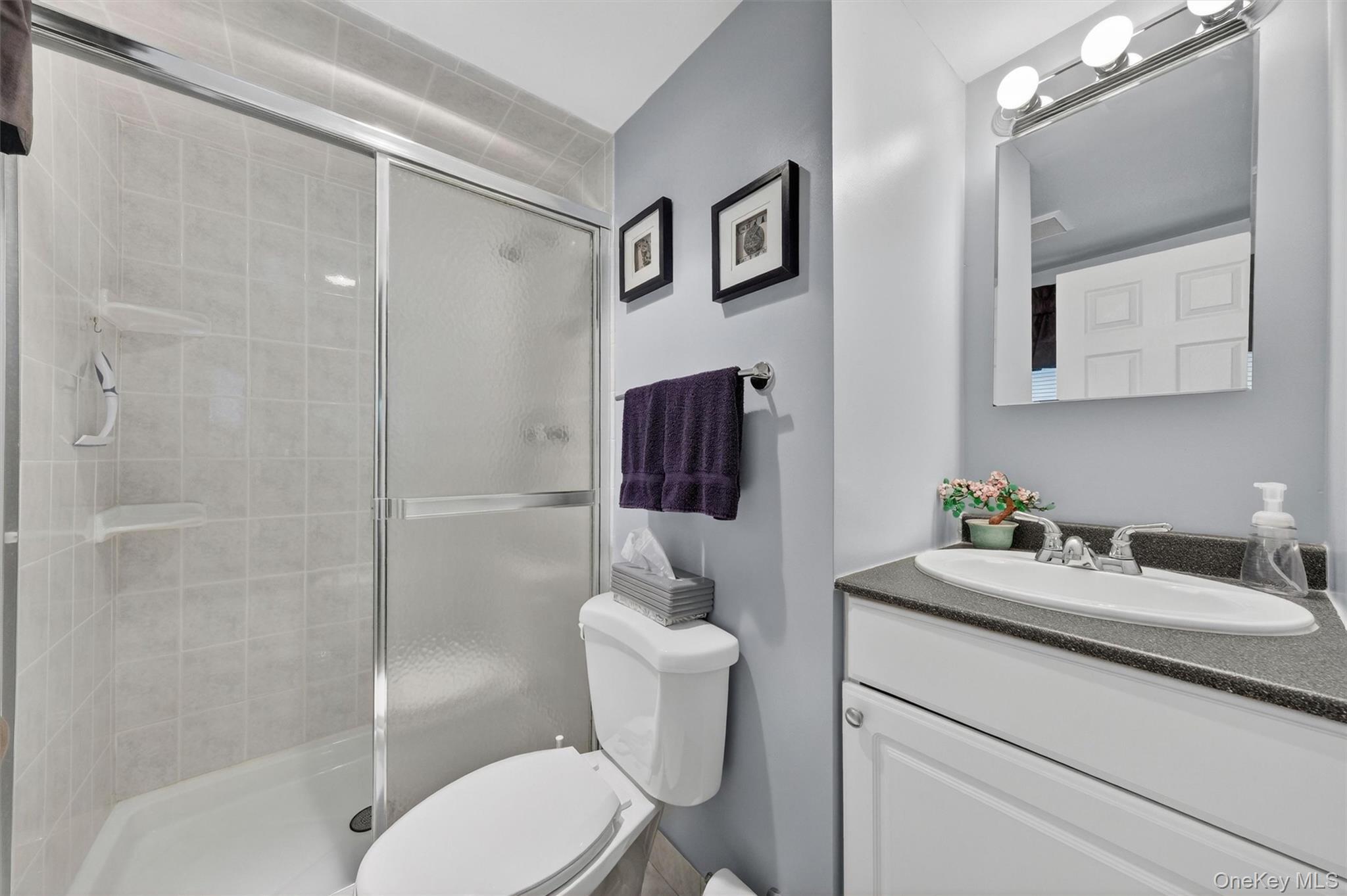 1 Rockledge Road Poughkeepsie, NY 12601 - Photo 20 of 36 Primary Bathroom featuring a tiled shower with sliding glass doors