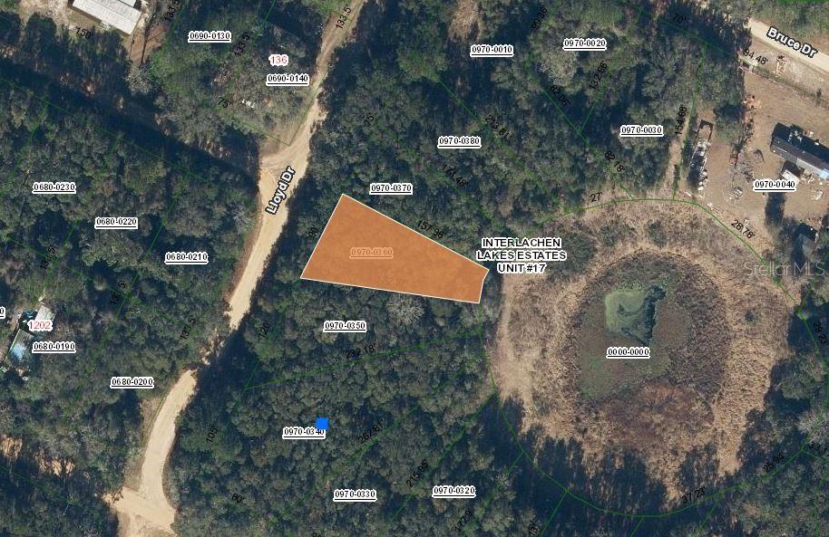 an aerial view of house with yard