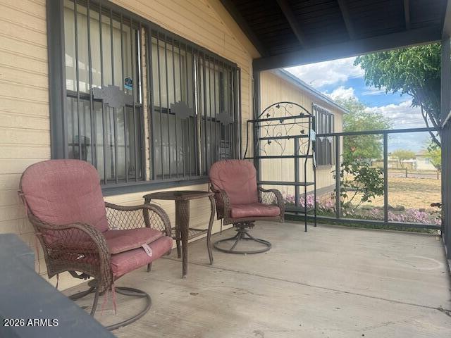 7258 South Lariat Road Hereford, AZ 85615 - Photo 3 of 37 a balcony with table and chairs