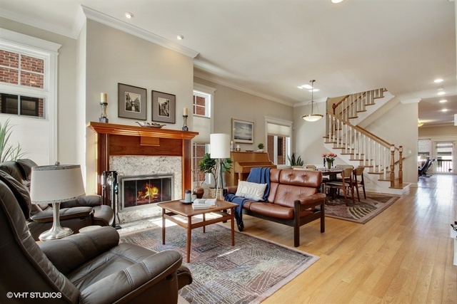 2117 Harrison Street Evanston, IL 60201 - Photo 2 of 26 a living room with furniture and a fireplace