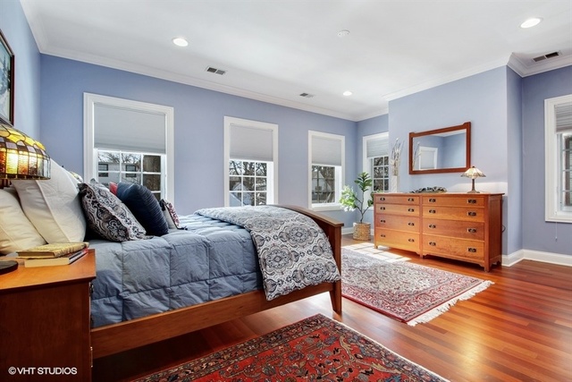 2117 Harrison Street Evanston, IL 60201 - Photo 11 of 26 a bedroom with a bed window and couch