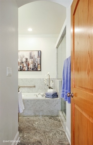 2117 Harrison Street Evanston, IL 60201 - Photo 12 of 26 a bathroom with a sink and a mirror