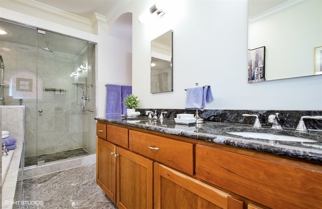 2117 Harrison Street Evanston, IL 60201 - Photo 13 of 26 a bathroom with a granite countertop sink mirror and double