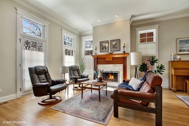 2117 Harrison Street Evanston, IL 60201 - Photo 3 of 26 a living room with furniture and a fireplace