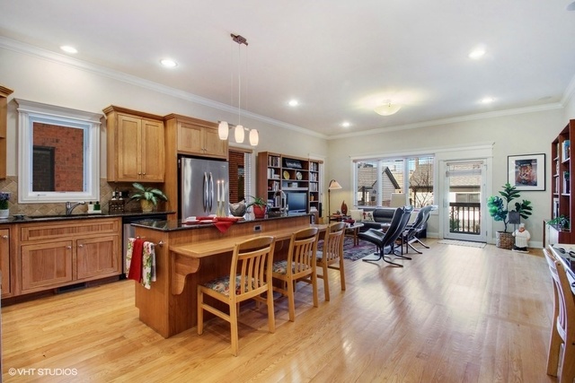 2117 Harrison Street Evanston, IL 60201 - Photo 5 of 26 a view of a dining room with furniture window and wooden floor