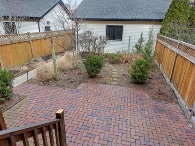 2117 Harrison Street Evanston, IL 60201 - Photo 7 of 26 a front view of a house with garden