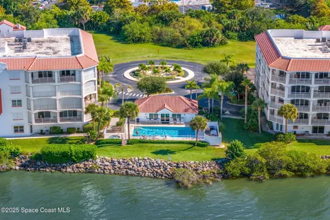 a view of a swimming pool with a garden and plants