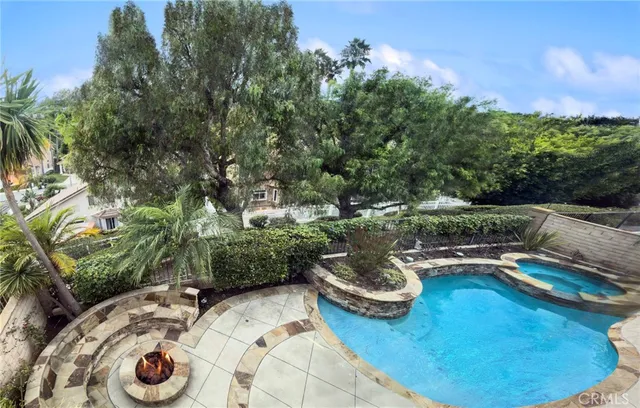a view of swimming pool with patio