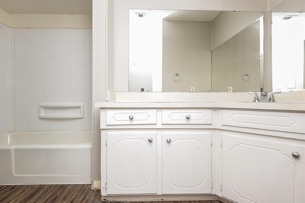 3001 Rufe Snow Drive Richland Hills, TX 76118 - Photo 13 of 15 a bathroom with a sink and a mirror