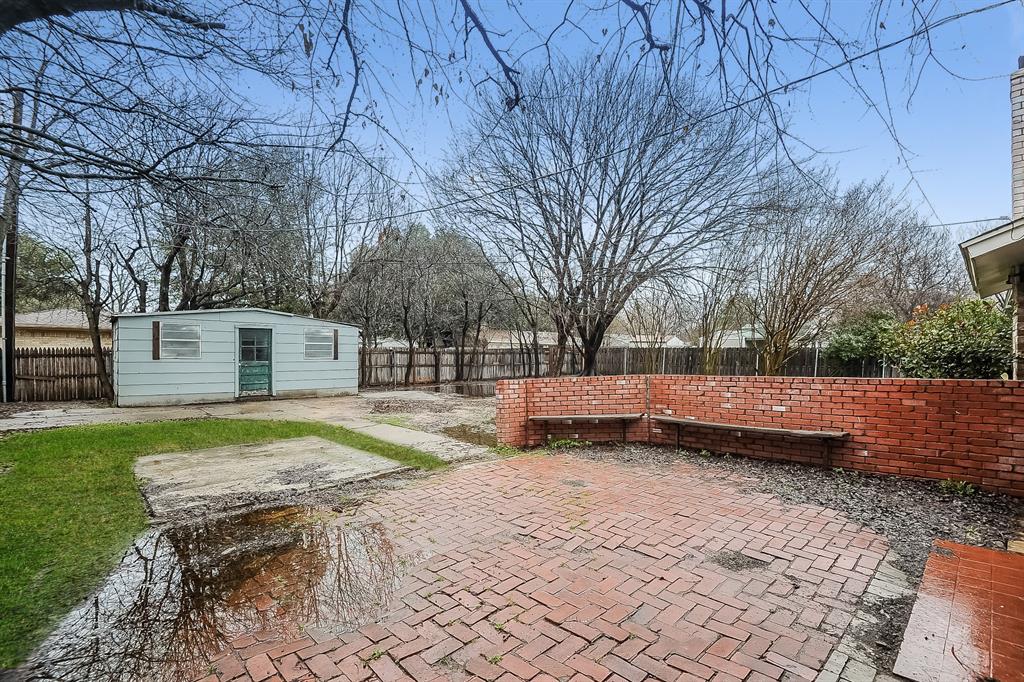 3001 Rufe Snow Drive Richland Hills, TX 76118 - Photo 15 of 15 a view of a backyard with large trees