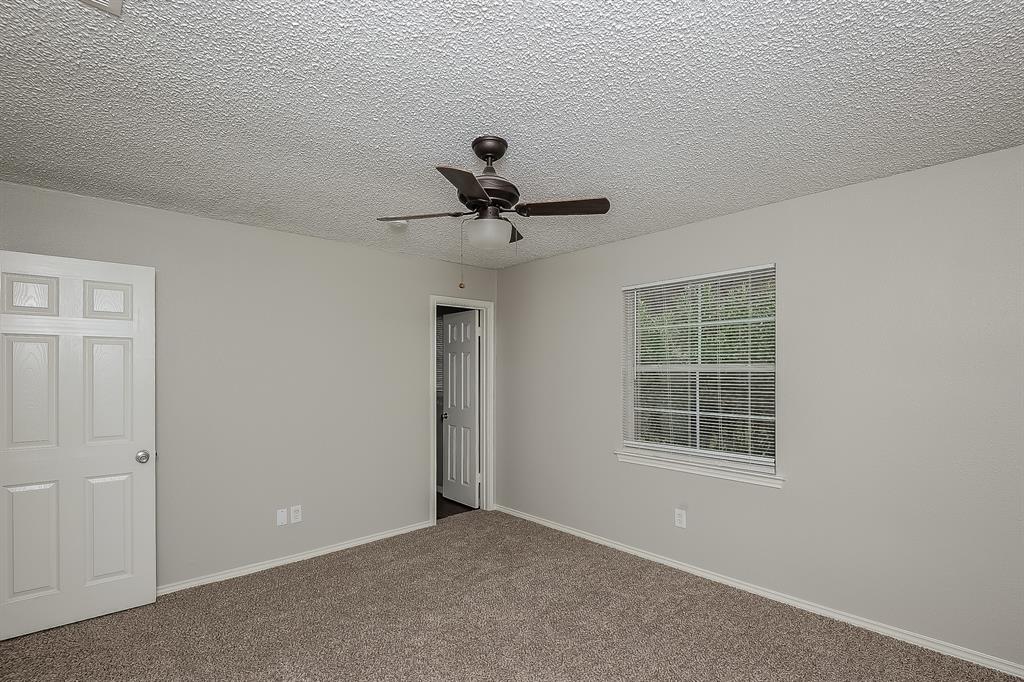 3001 Rufe Snow Drive Richland Hills, TX 76118 - Photo 8 of 15 a view of room with ceiling fan and window