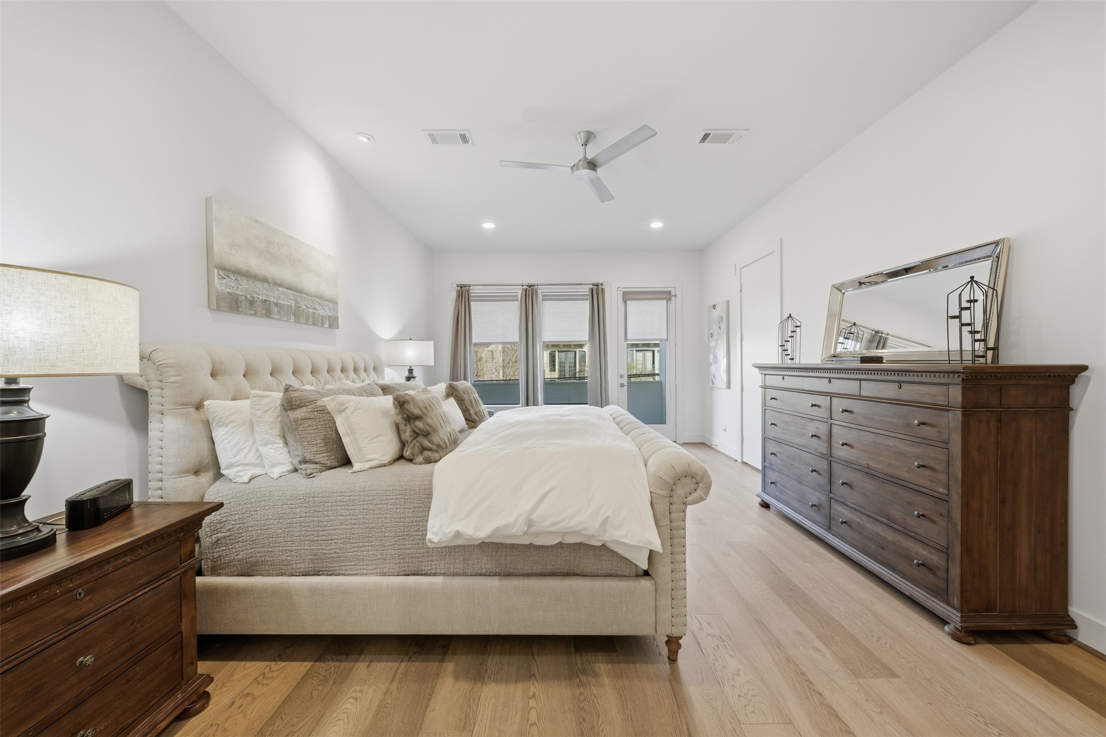 2114 McDuffie Street Houston, TX 77019 - Photo 26 of 45 A king sized bed with a full compliment of furniture arranges nicely in the primary suite.