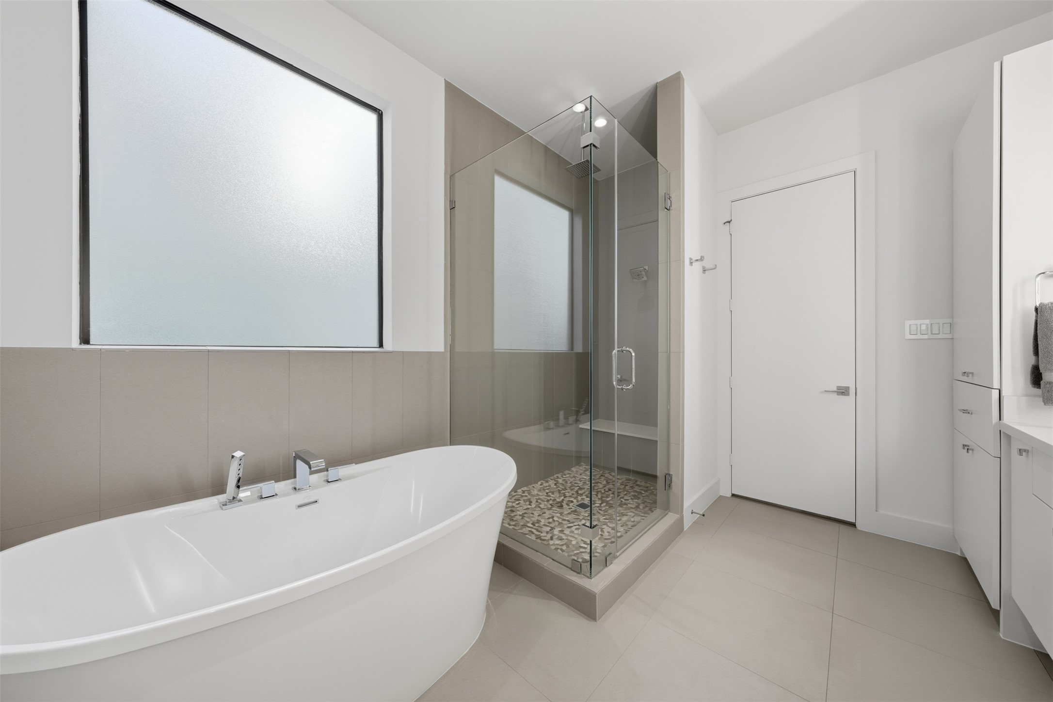 2114 McDuffie Street Houston, TX 77019 - Photo 29 of 45 The oversized shower has both a rainfall shower head and fixed wall mounted shower head.