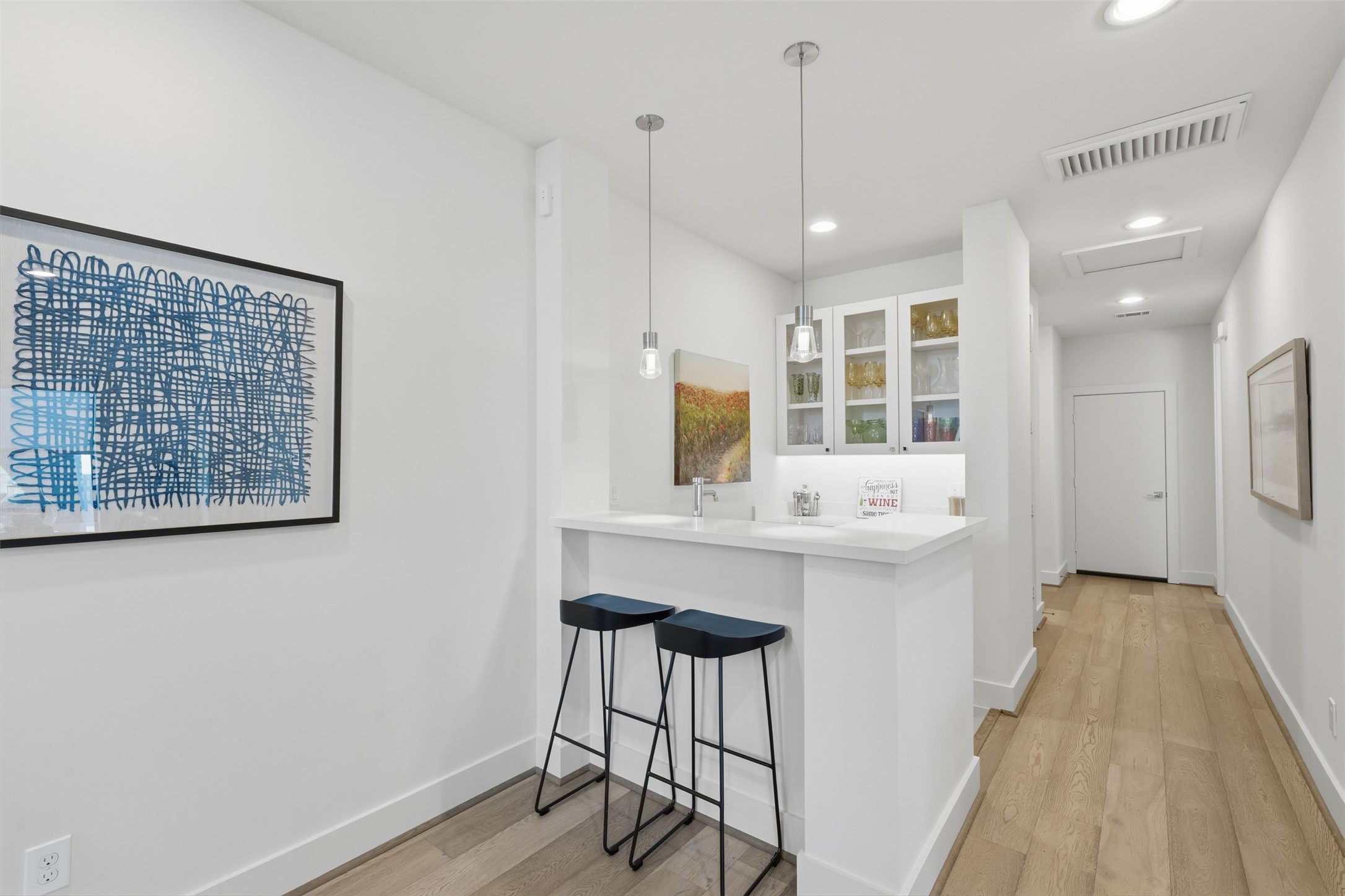 2114 McDuffie Street Houston, TX 77019 - Photo 41 of 45 This wet bar with a beverage refrigerator and seating is also on the third floor.