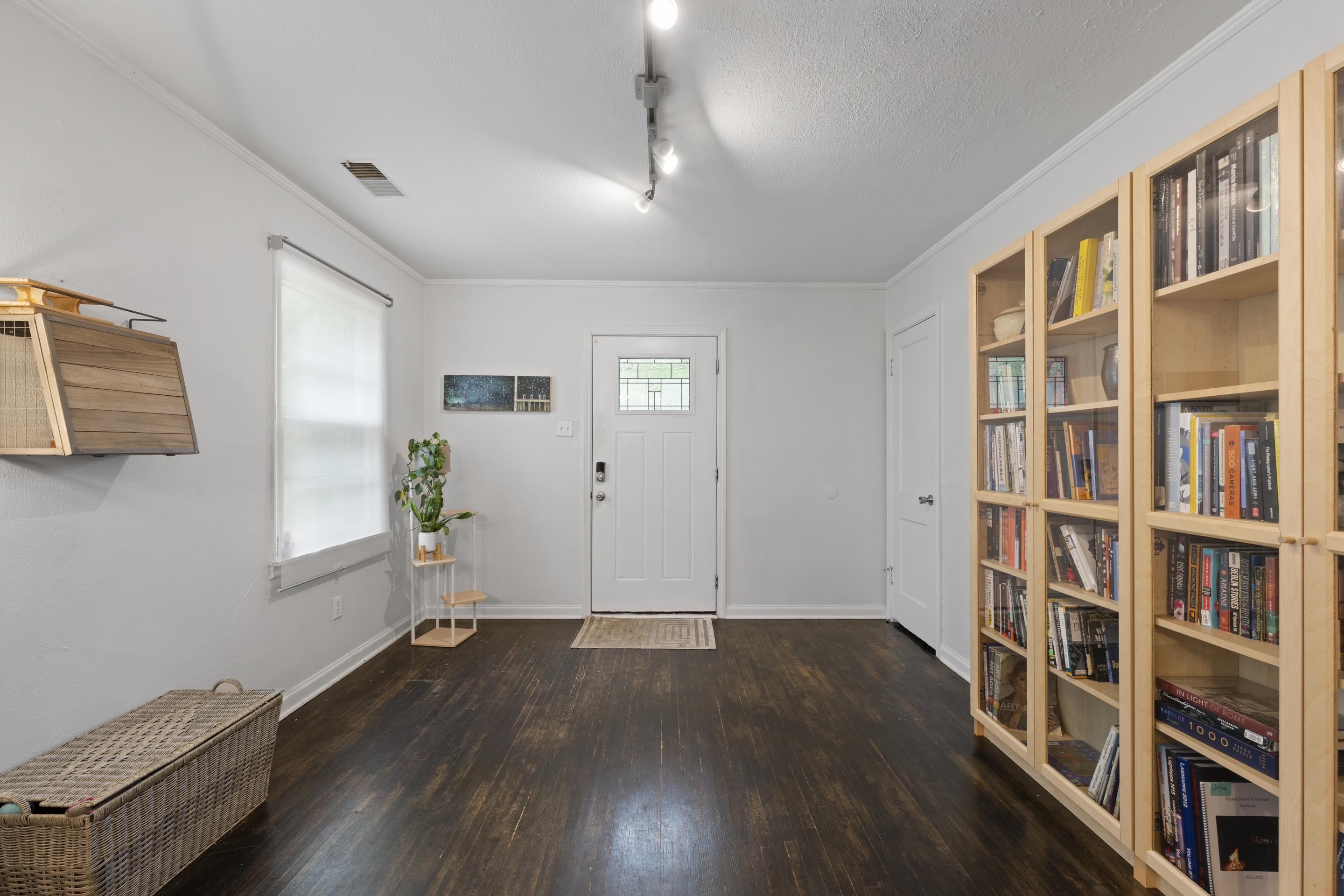 1343 Dearing Road Memphis, TN 38117 - Photo 3 of 19 Entryway featuring wood-finish flooring, white walls, and track lighting