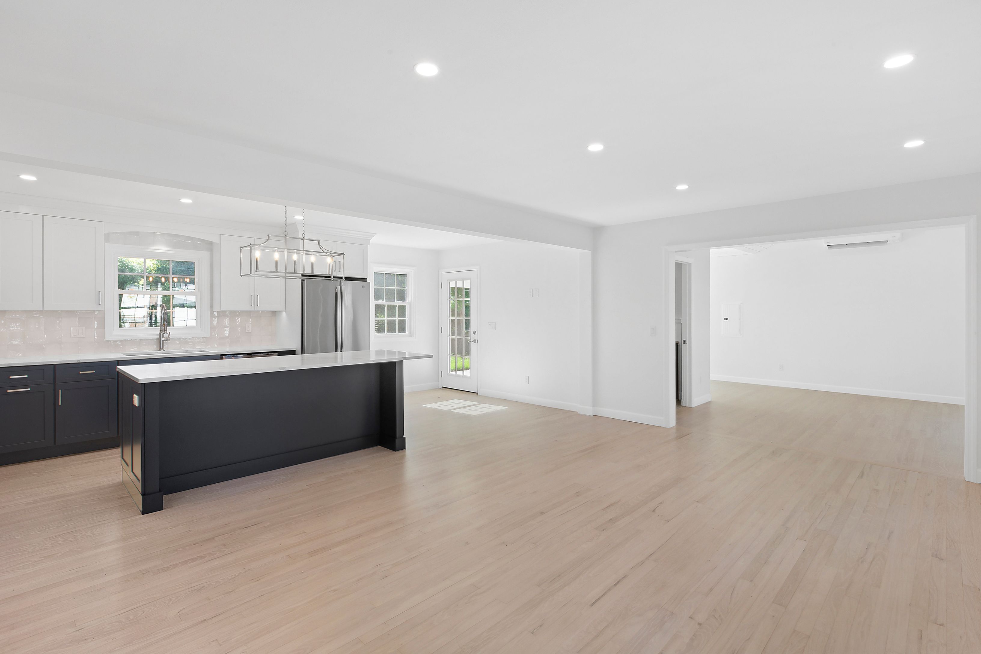 6 Whiting Road East Quogue, NY 11942 - Photo 12 of 18 a large room with a large window