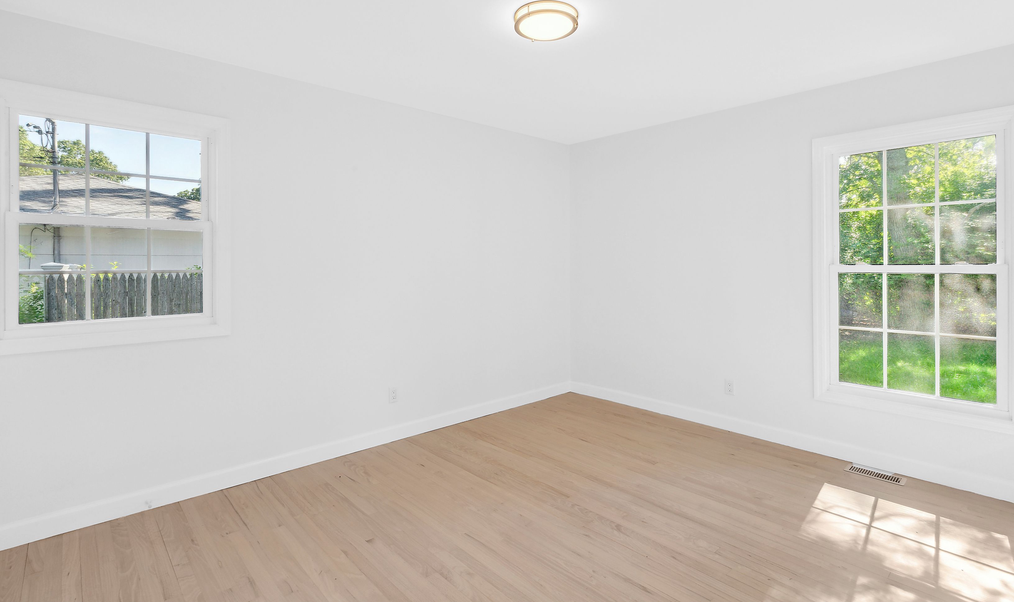 6 Whiting Road East Quogue, NY 11942 - Photo 5 of 18 an empty room with a window