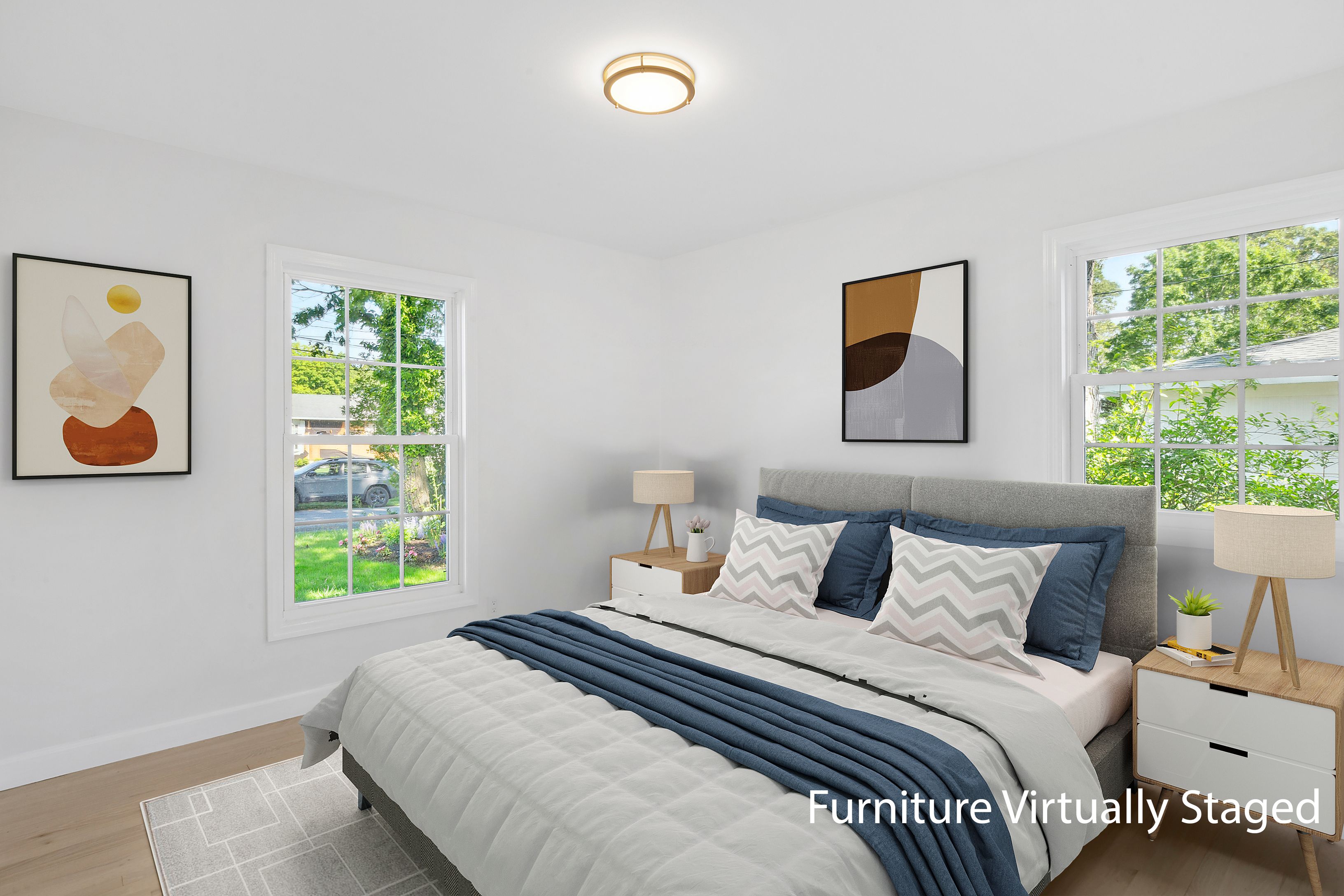 6 Whiting Road East Quogue, NY 11942 - Photo 9 of 18 a bedroom with a bed and a painting on the wall