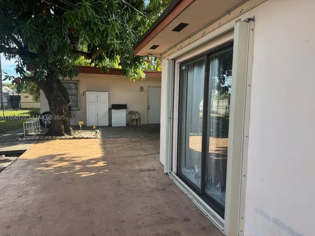 a view of a house with a yard and garage