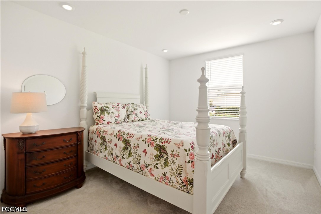 3751 Pebblebrook Ridge Court, Unit 101 Fort Myers, FL 33905 - Photo 23 of 48 a bedroom with a bed and a window