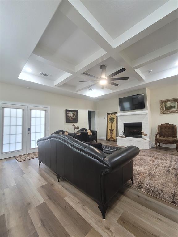 4825 Wichita Street Granbury, TX 76048 - Photo 17 of 30 a living room with furniture and a fireplace