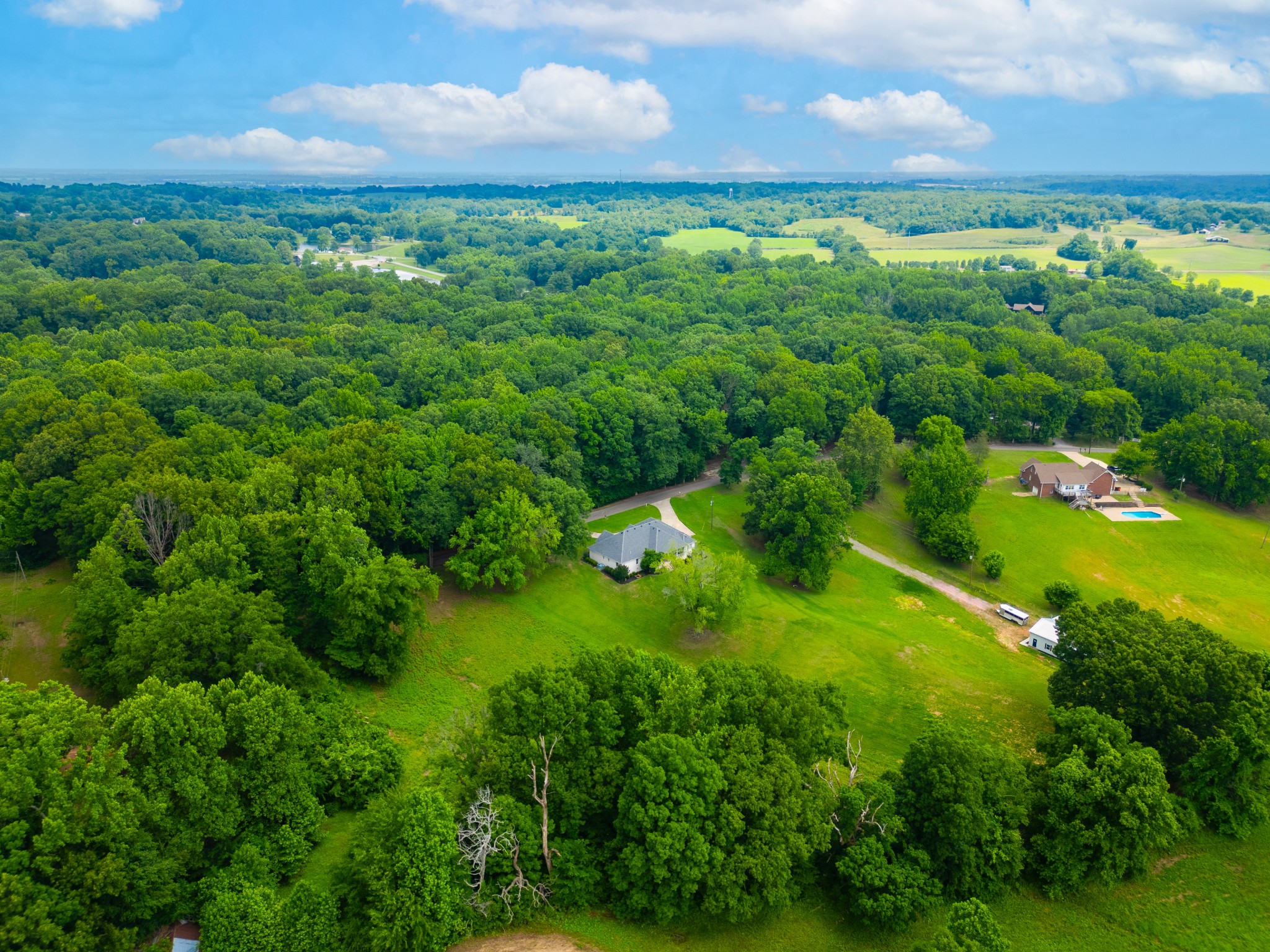 1015 Kelly Road Dyersburg, TN 38024 - Photo 32 of 41 a view of a city and lush green forest