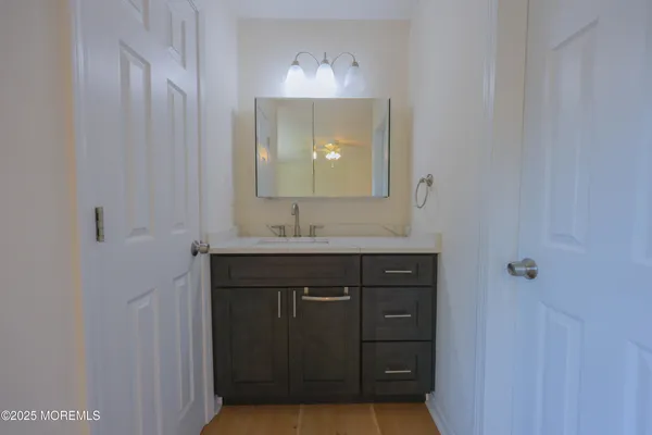 a bathroom with a sink and a mirror