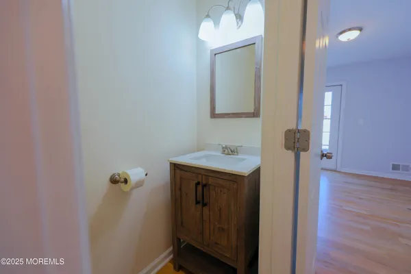 a bathroom with a sink and mirror