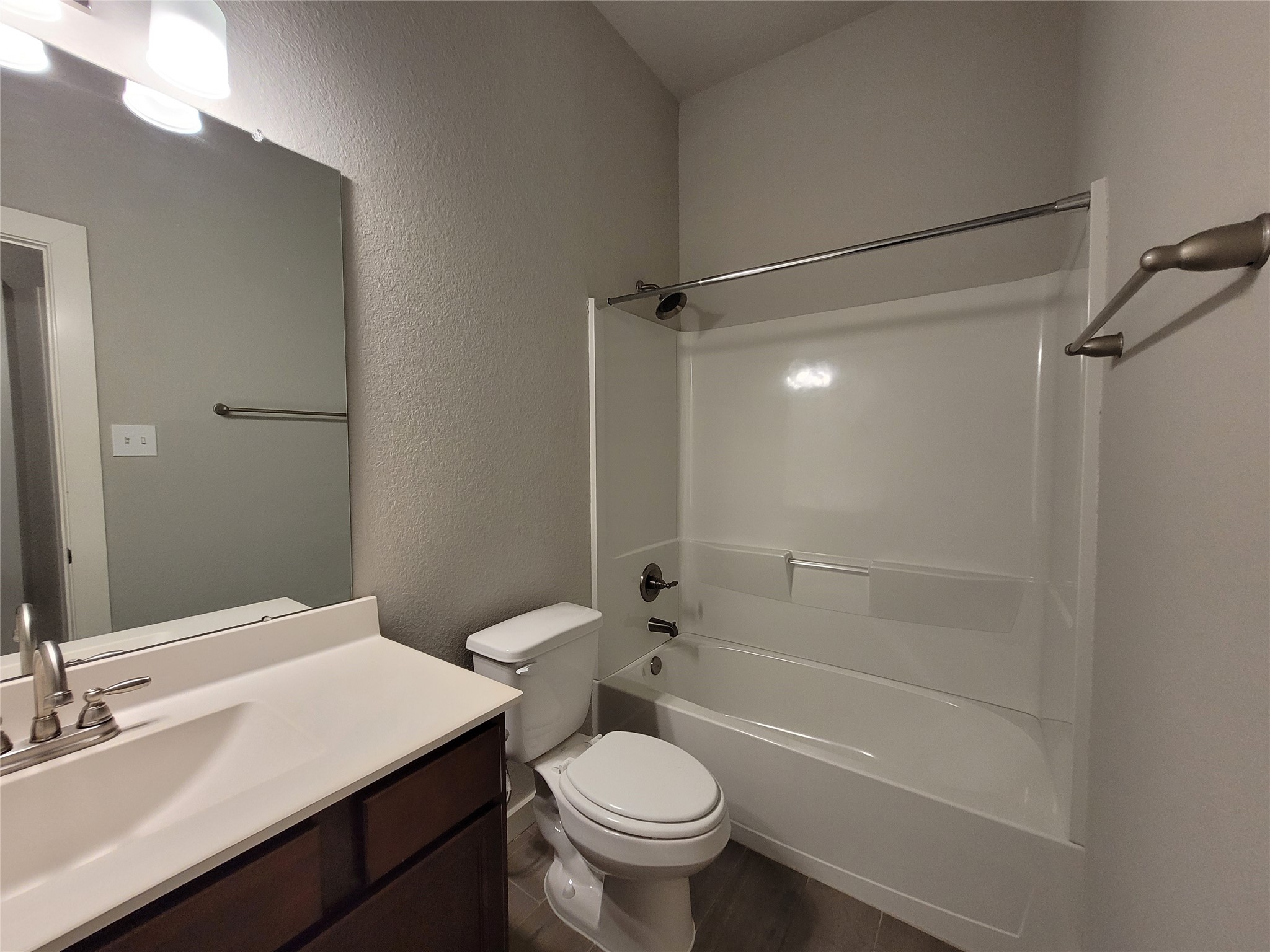 210 Oakcrest, Unit A Conroe, TX 77304 - Photo 9 of 17 a bathroom with a sink a toilet and shower
