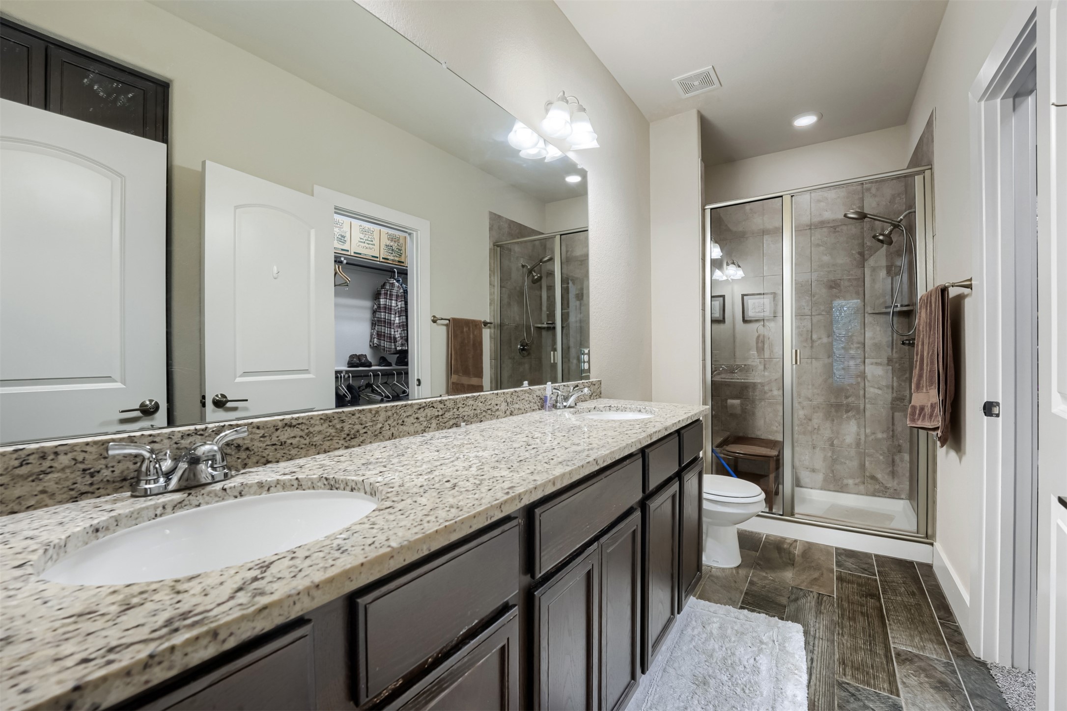 418 High Tech Drive Georgetown, TX 78626 - Photo 16 of 34 Double vanity featuring light granite countertops and undermount sinks