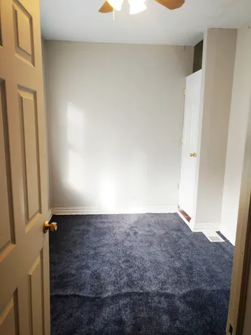 a view of a hallway with a white walls