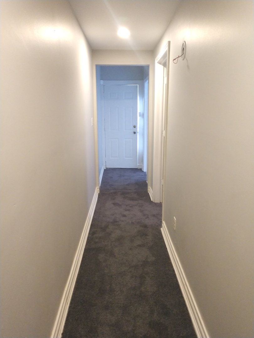 853 Adams Street, Unit 1 Waukegan, IL 60085 - Photo 9 of 9 a view of a hallway