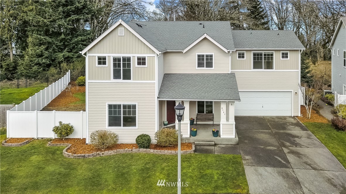 3141 Walker Road DuPont, WA 98327 - Photo 1 of 18 a view of a yard in front of house