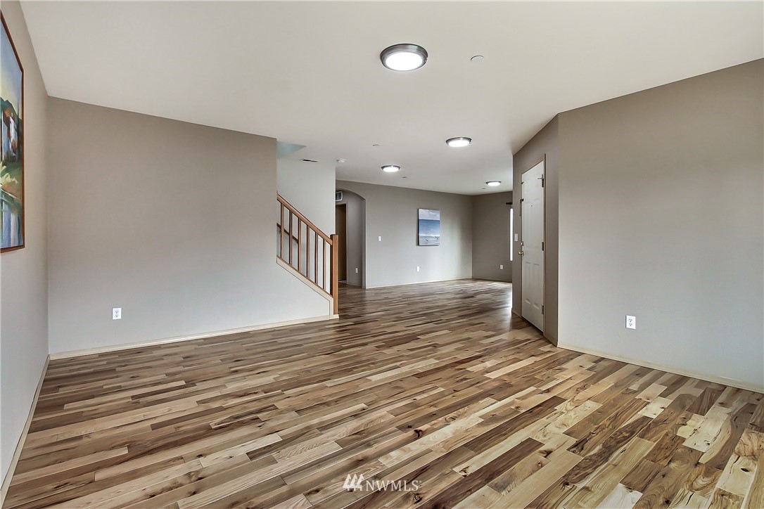3141 Walker Road DuPont, WA 98327 - Photo 11 of 18 a view of a room with wooden floor and staircase