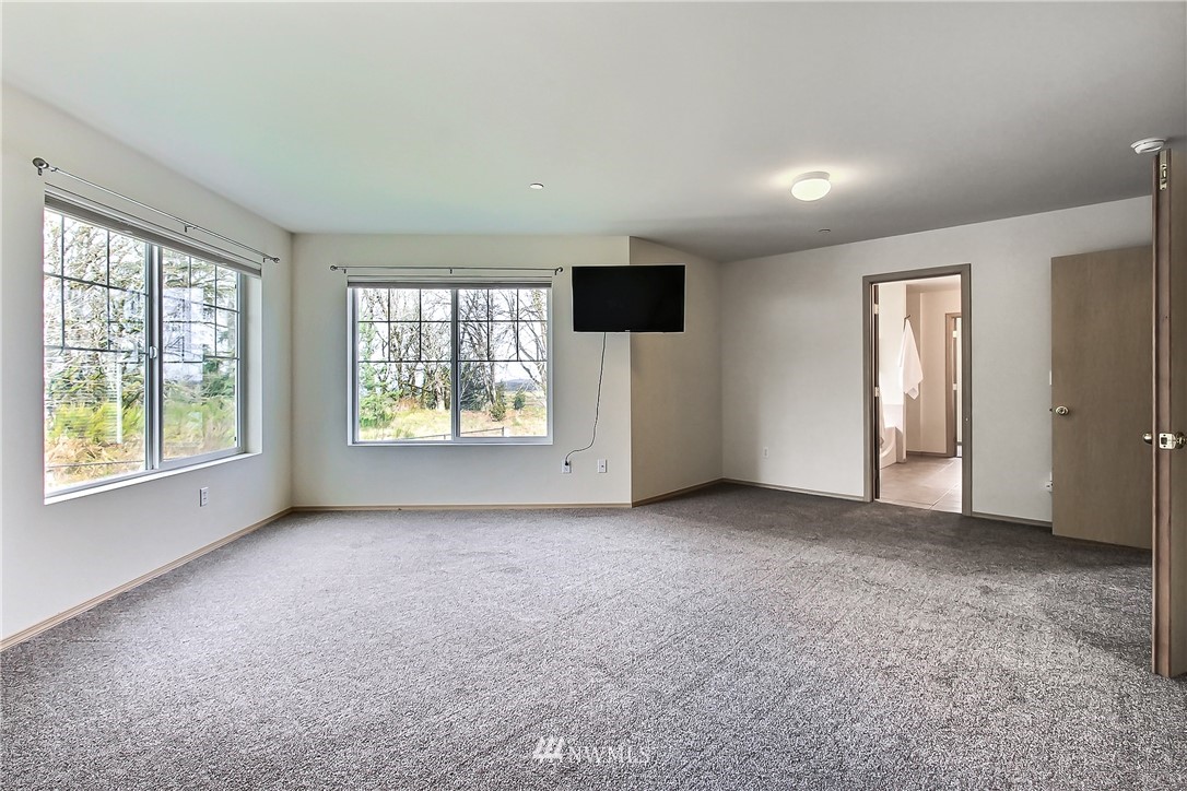 3141 Walker Road DuPont, WA 98327 - Photo 16 of 18 an empty room with windows and closet