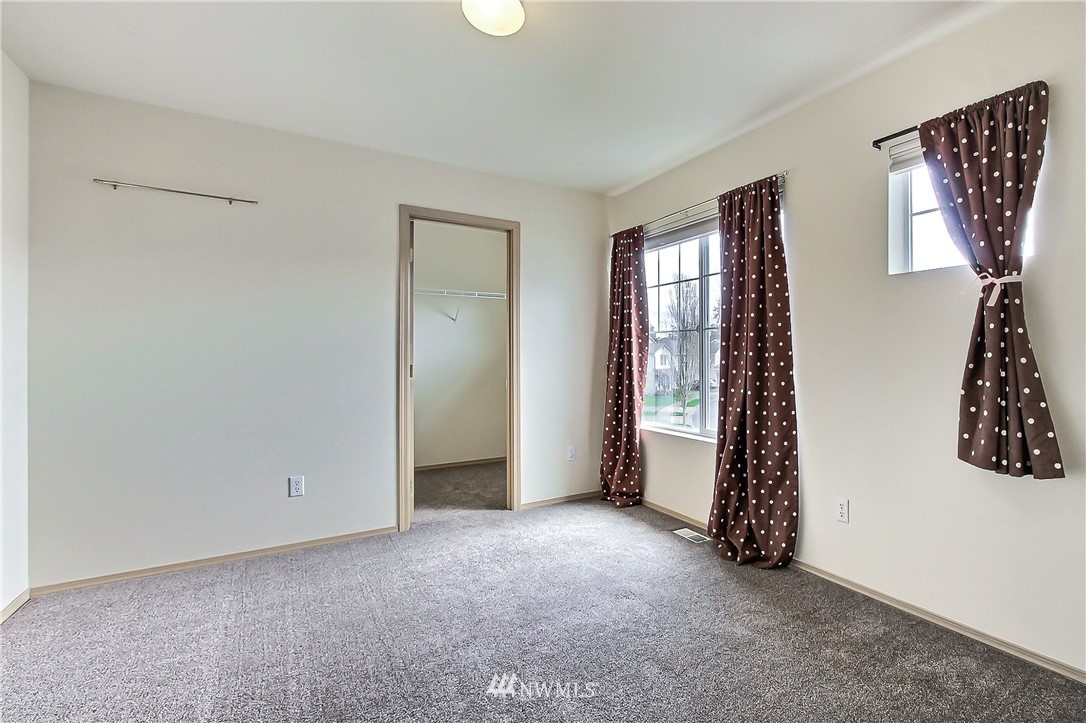 3141 Walker Road DuPont, WA 98327 - Photo 18 of 18 an empty room with windows and closet