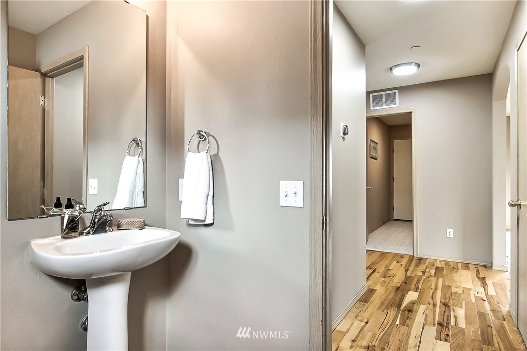 3141 Walker Road DuPont, WA 98327 - Photo 9 of 18 a bathroom with a sink and a mirror