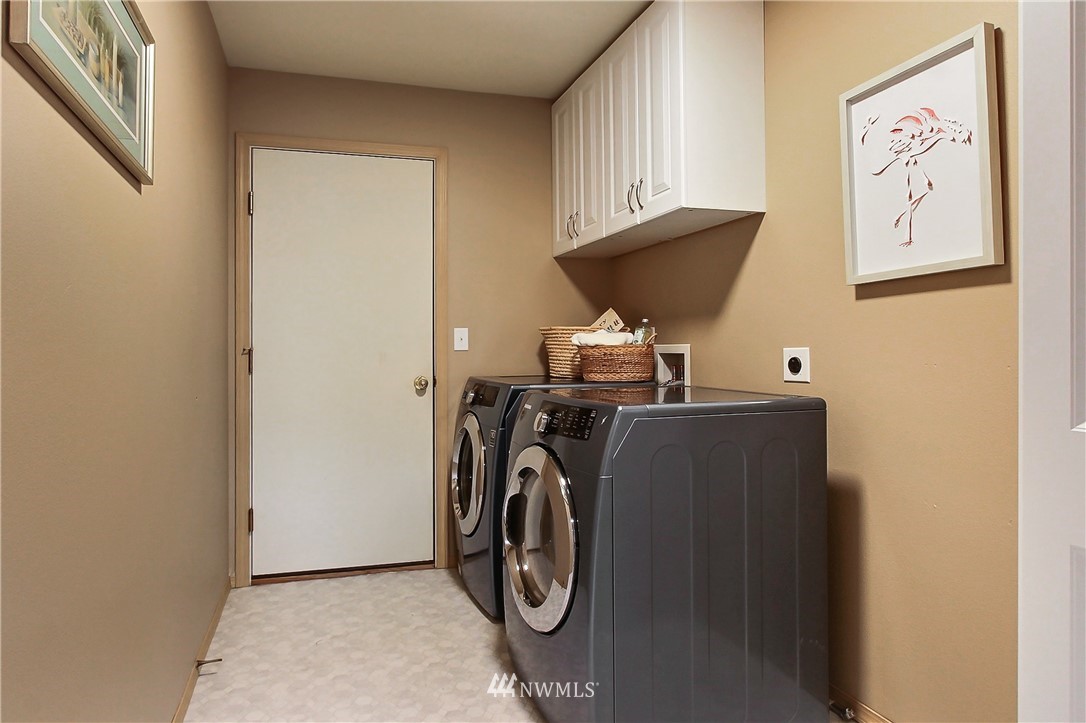 3141 Walker Road DuPont, WA 98327 - Photo 10 of 18 a view of storage and utility room with washer and dryer