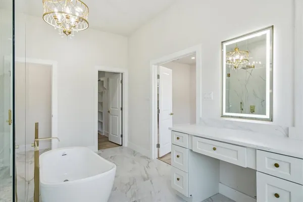 a bathroom with a bathtub and a sink