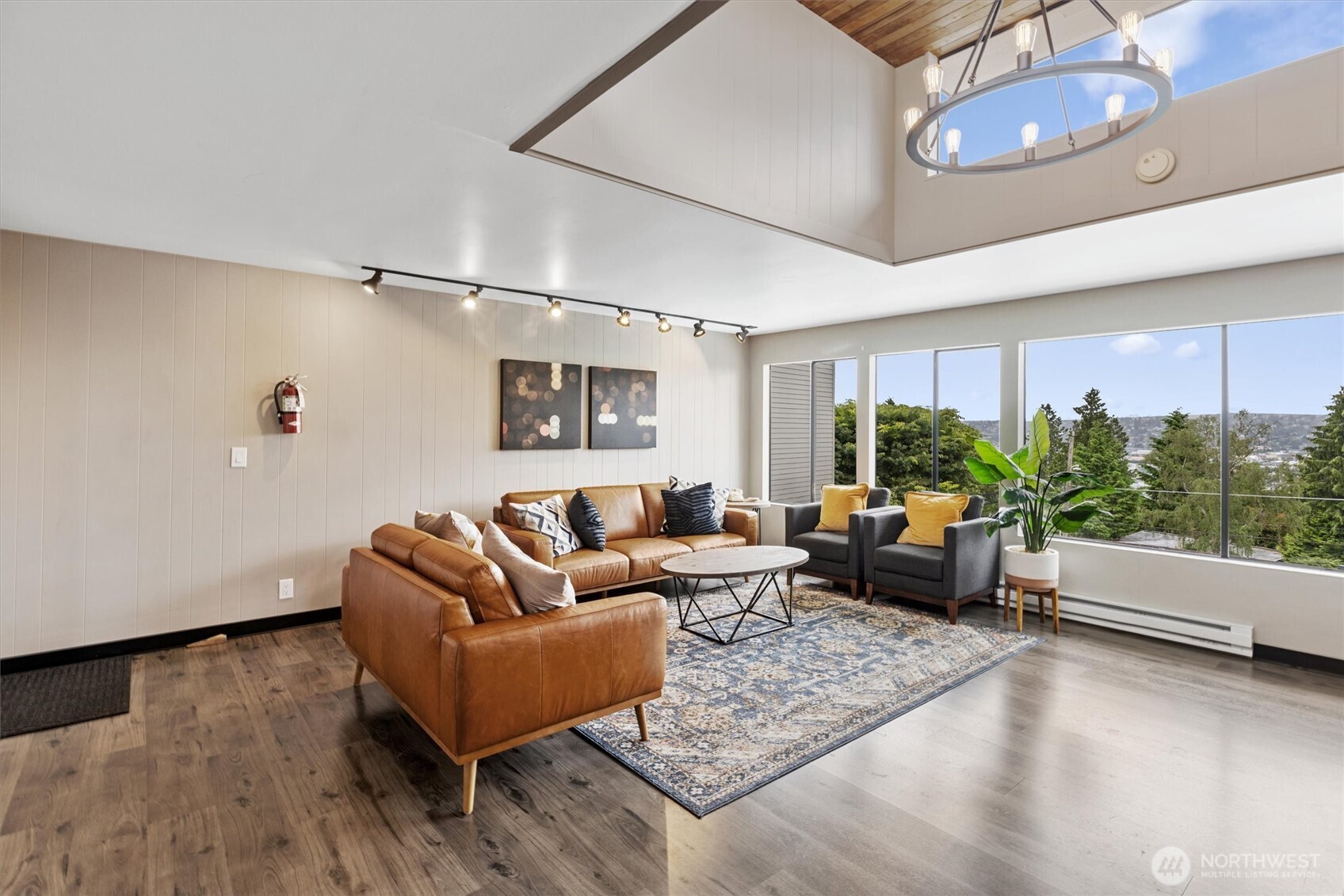 3608 26th Place West, Unit 201 Seattle, WA 98199 - Photo 22 of 33 a living room with furniture and a large window