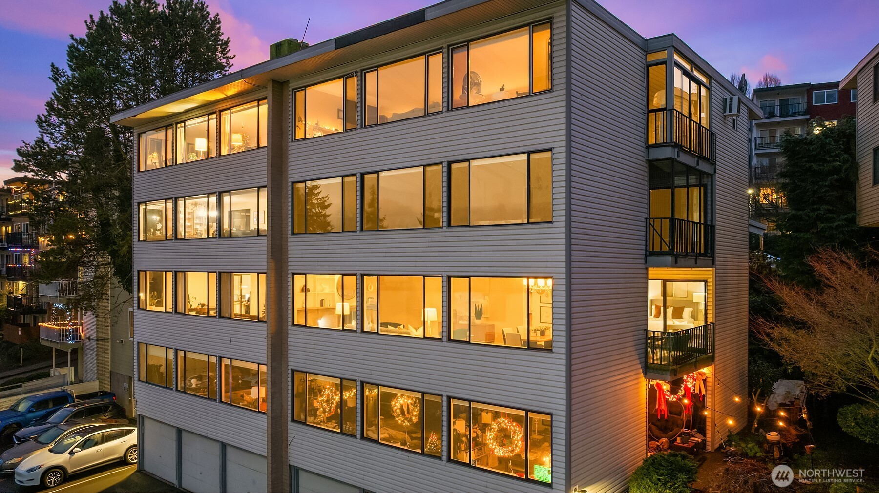 3608 26th Place West, Unit 201 Seattle, WA 98199 - Photo 29 of 33 a front view of a building with a street