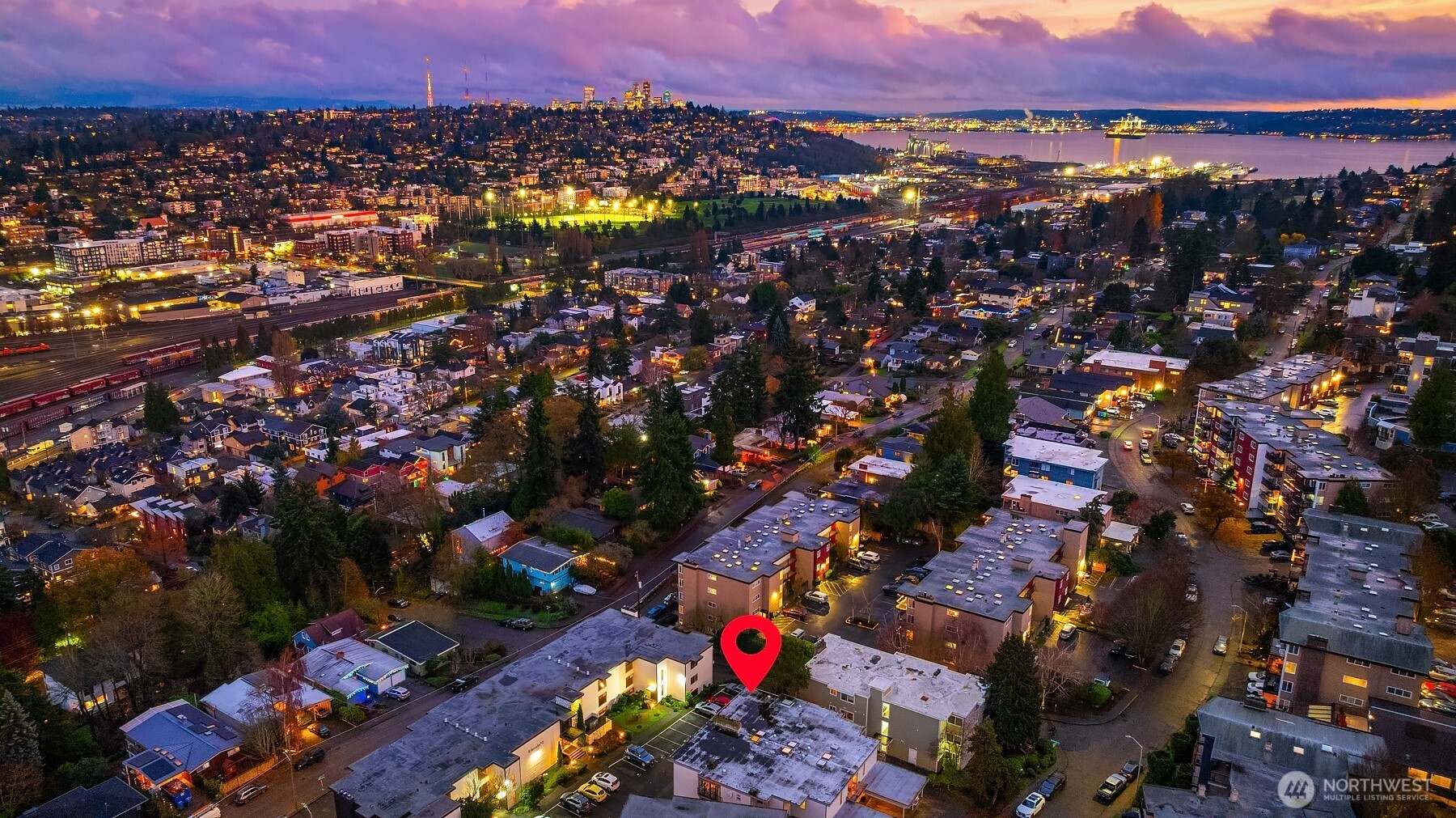 3608 26th Place West, Unit 201 Seattle, WA 98199 - Photo 31 of 33 an aerial view of residential houses with outdoor space and trees