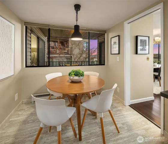 a dining room with furniture and window
