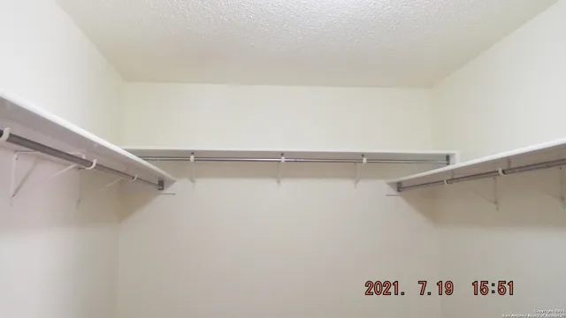 a view of an empty walk in closet